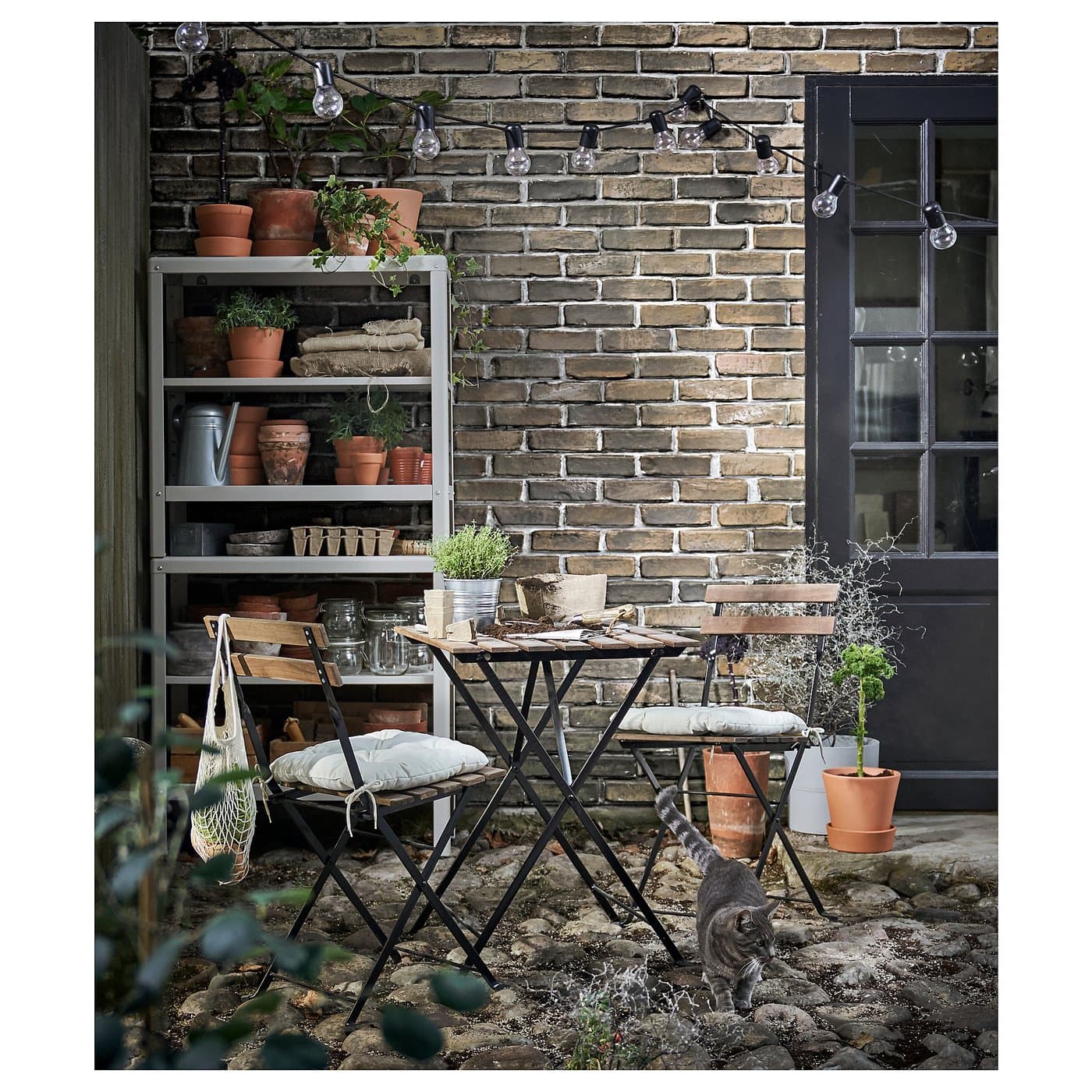 TÄRNÖ Chair, outdoor - foldable black/light brown stained — image 2
